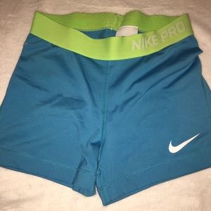 Women’s Turquoise Nike Pros (Size: Medium)